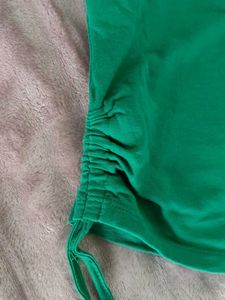 GREEN CROP TOP WITH SIDE STRINGS