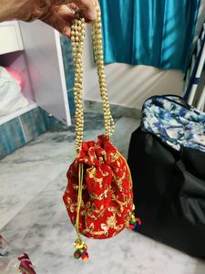 Red embroidery potli