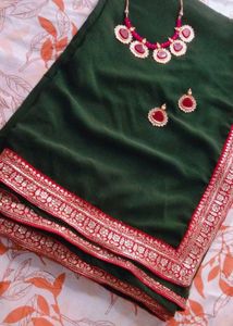 Elegant Green Saree with Pink Border