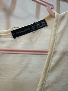 Formal Cream Sleeveless Top with Black Bow