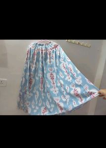 White Top And Blue Skirt