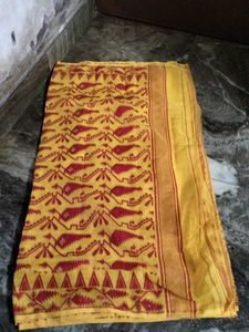 Elegant Yellow Saree with red Blouse.