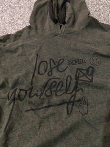 a dark green color hoodie