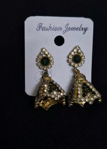 green emerald-toned earrings