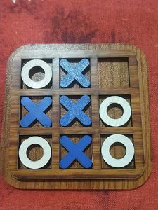 a wooden tic tak toe game board with 8 pieces