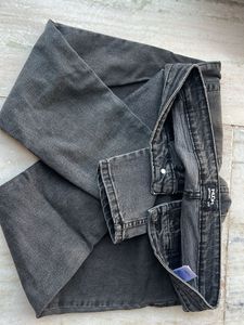 Distressed grey jeans