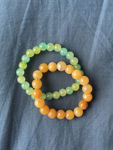Beaded Bracelets In The Colours Green And Ochre