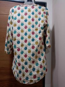 (Max) Cream Base With Pink,Teal,Mustard, And Blue.