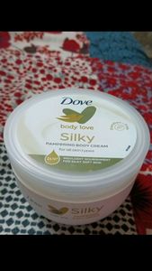 it is a moisturizer, new, unused, dove silky pampering cream body love