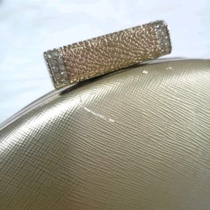Golden Clutch Bag With Chain Sling Attachment