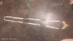 A white Long Harwm With Bracelight.