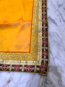 Yellow and brown new saree with intact blouse piec