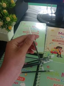 4 SANK MAGIC WRITING BOOKS WITH 1-3  REFILLS.