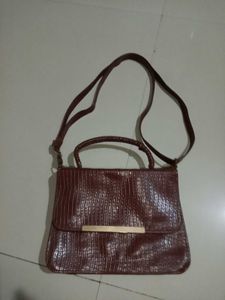 brown handbag crocodile pattern