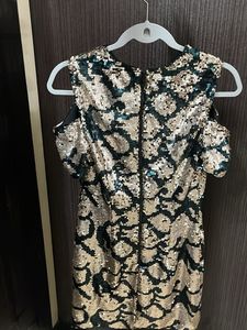 Embellished bodycon cold shoulder dress.