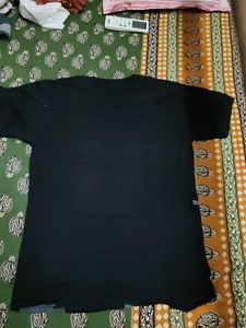 A BLACK T-SHIRT