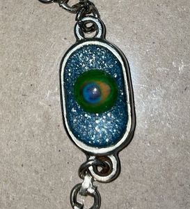 Krishna/Peacock-feathered chain