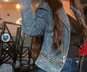 A Denim Jacket With Metallic Star Work On It