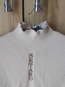 Cute Beige High Necl Top With Ruffle Nect Detail