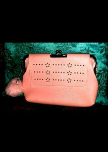 Pink kiss-lock coin purse