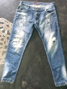 Distressed Blue Denim Jeans