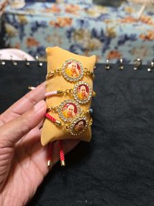 Set Of Four Guruji Thread Bracelets With Cushion