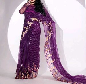 Celebrity Purple Netted Saree With Designer Blouse