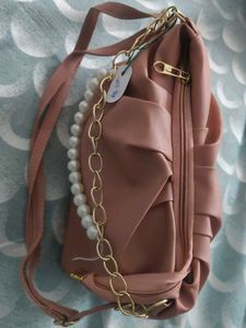 Stylish Pink Handbag with Chain Detail