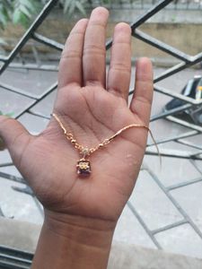 Gold Chain with Purple Gem