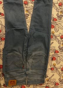 Distressed Light Wash Denim Jeans