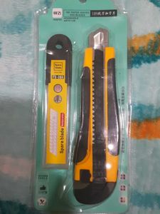 utility knife and a pack of spare blades
