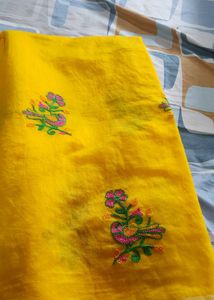 Yellow Embroidered saree and pink small  border