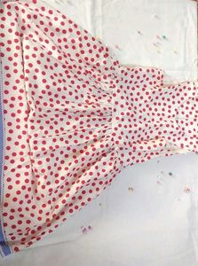 A Beautiful White Frok With Red Polka Dots