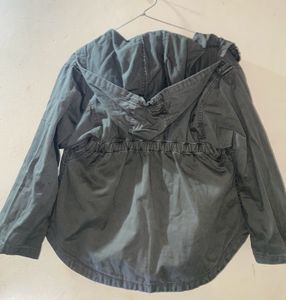 A Green Jacket For Both Girls And Boys