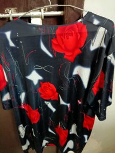 smart black top with red flowers on it