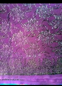 A Purple Colour Saree With Blouse