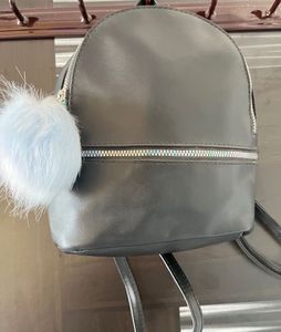 Black Mini Backpack with Pom Po