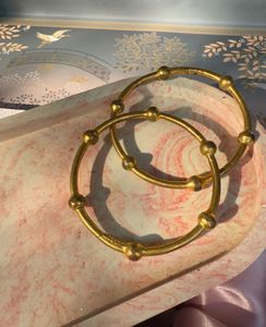pair of gold bangles