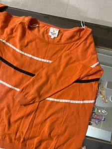 again orange broad neck top