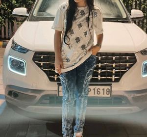 Ripped Blue Jeans With White Baggy Tshirt
