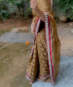 Elegant Brown Saree with Red Border