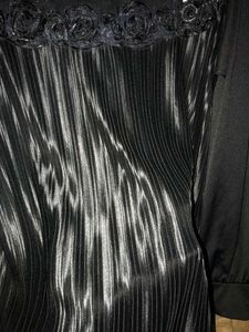 Elegant black pleated top.