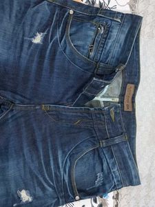 Distressed Blue Denim Jeans