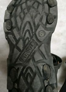 A Lightly Used Black Sandle