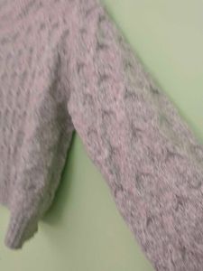 girls woolen sweater of white colour