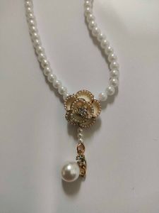 Pearl Necklace with Camellia Pendant
