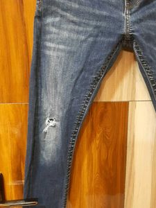 Ripped Blue Denim Jeans