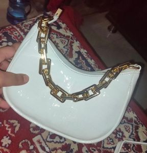 White shoulder bag with gold chain