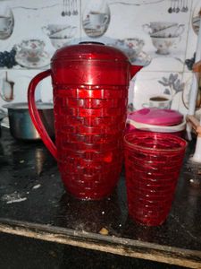 Red Plastic Pitcher with Glass