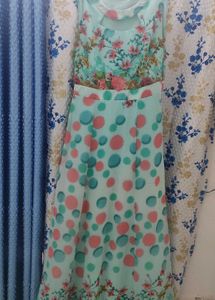 It's a pure georgette sleeveless floral gown with